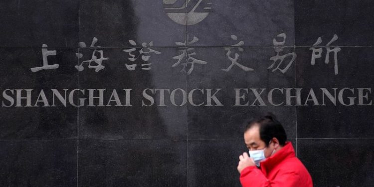 Asian shares bathed in Fed afterglow, yen jittery ahead of BOJ